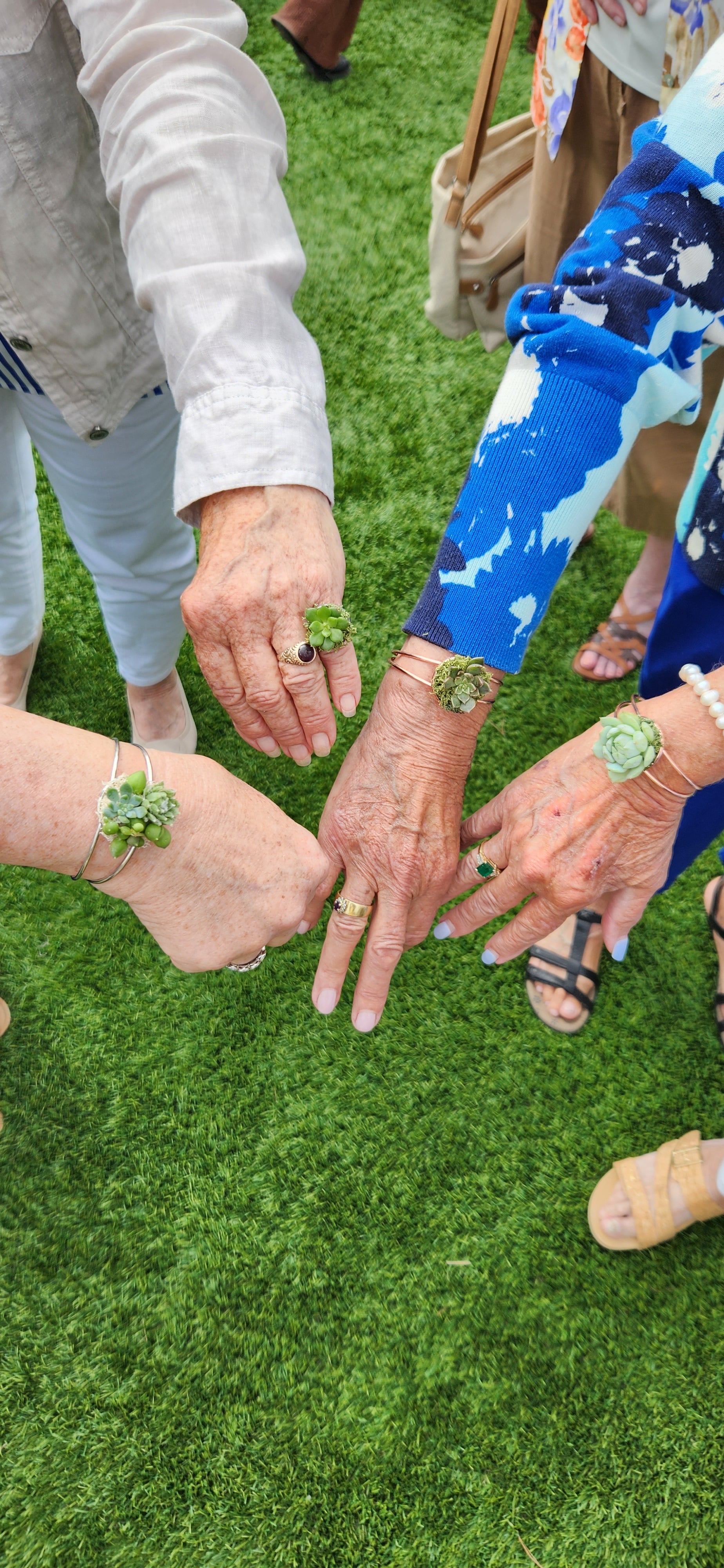 Guests showing off their succulent jewelry Guests showing off their succulent jewelry